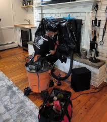 Protected hearth set up with professional chimney cleaning equipment